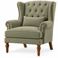 Sillón tapizado con botones decorativos y respaldo alto, verde y marrón
